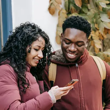 A couple looking at a phone together